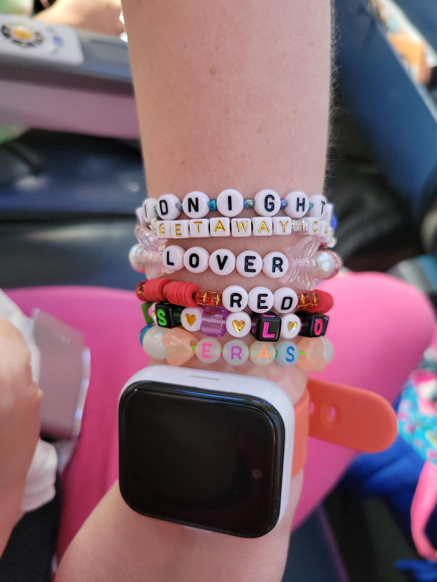 MAKE THE FRIENDSHIP BRACELETS Allen sports beaded bracelets at the concert. A trend among Swifties, creating bracelets with songs and lyrics. “the lyrics "Long live all the mountains we moved, I had the time of my life fighting dragons with you" bring back the names and faces of so many students that I have been honored to know over the years.” Allen says. PHOTO COURTESY OF KAT ALLEN
